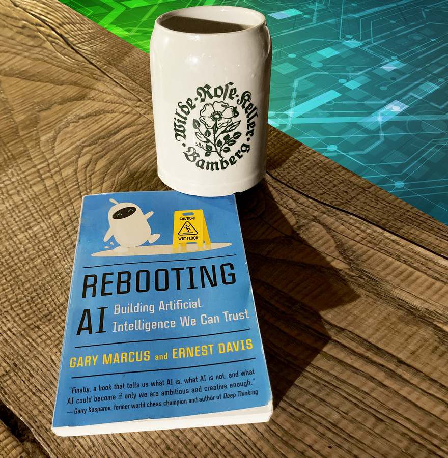 Ein Bierkrug und das Buch mit dem Titel "Rebooting AI"